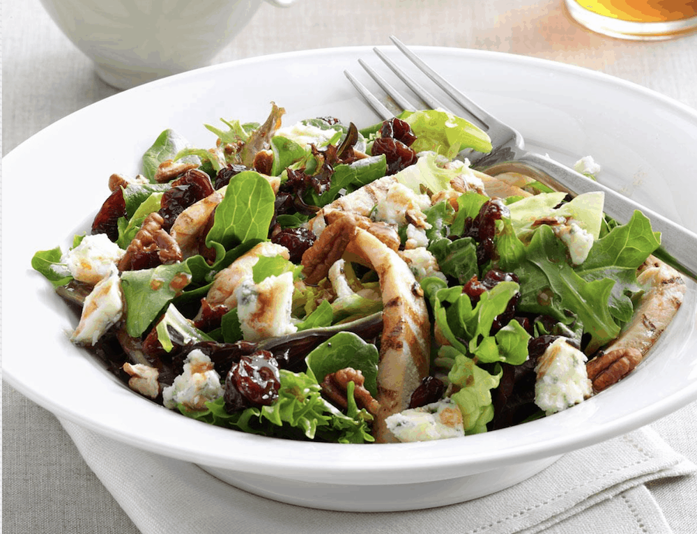 Crunchy pecan salad in white bowl