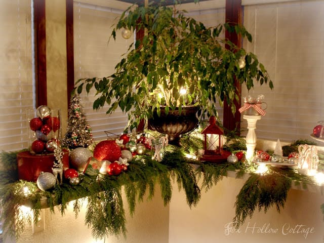 Christmas centerpiece and decor using ornaments twinkle lights and cedar boughs