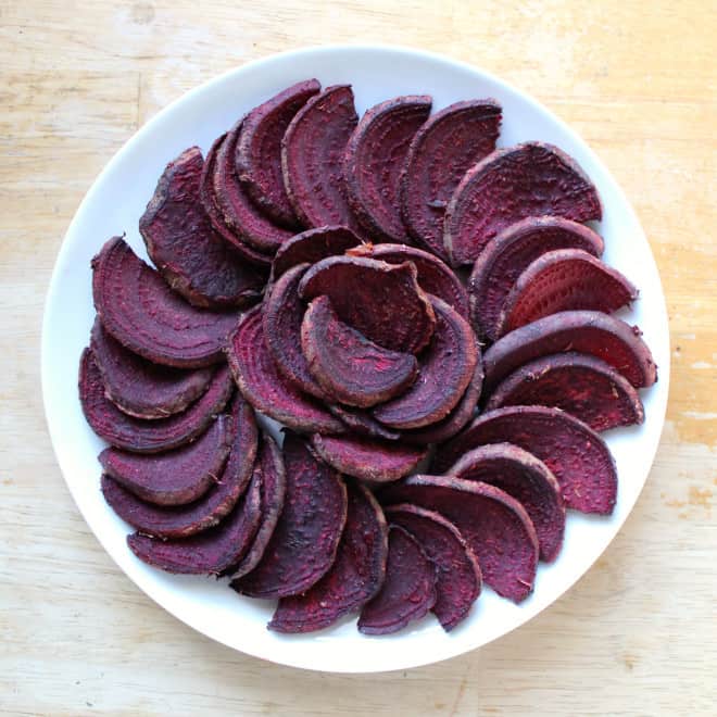 BBQ beet fries arranged in spiral on white plate