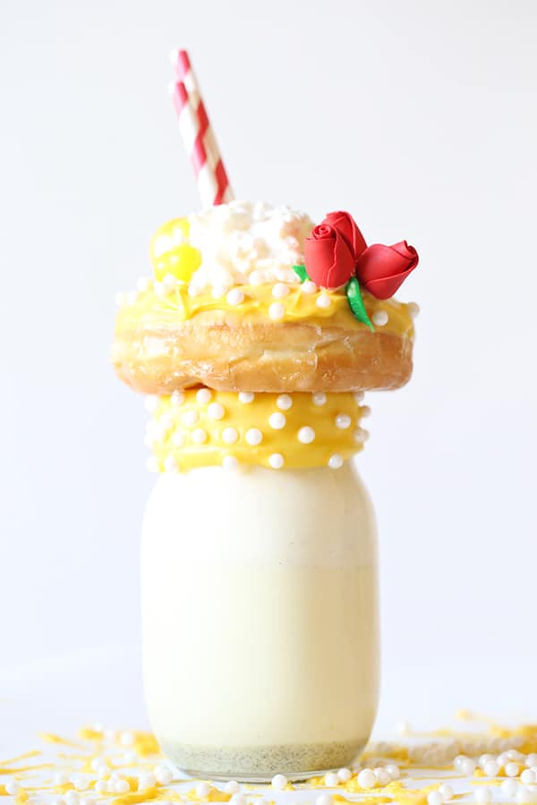 Yellow icing on donut on top of milkshake