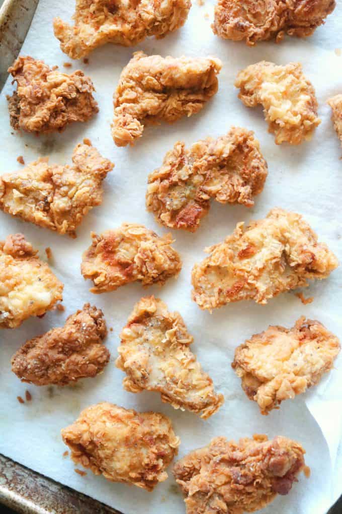 Homemade chicken nuggets on baking sheet. Healthy homemade lunch ideas for kids