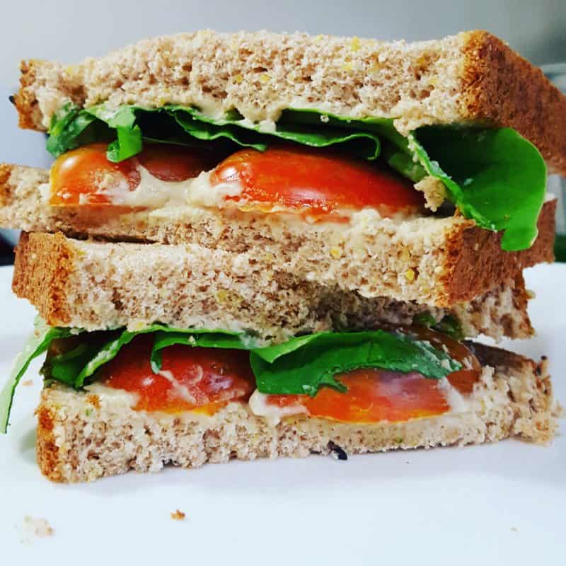 Tomato sandwich with lettuce and hummus