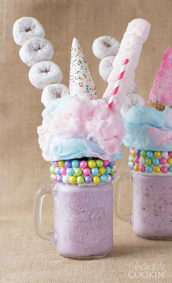 Unicorn milkshake extreme milkshake topped with donuts and candy